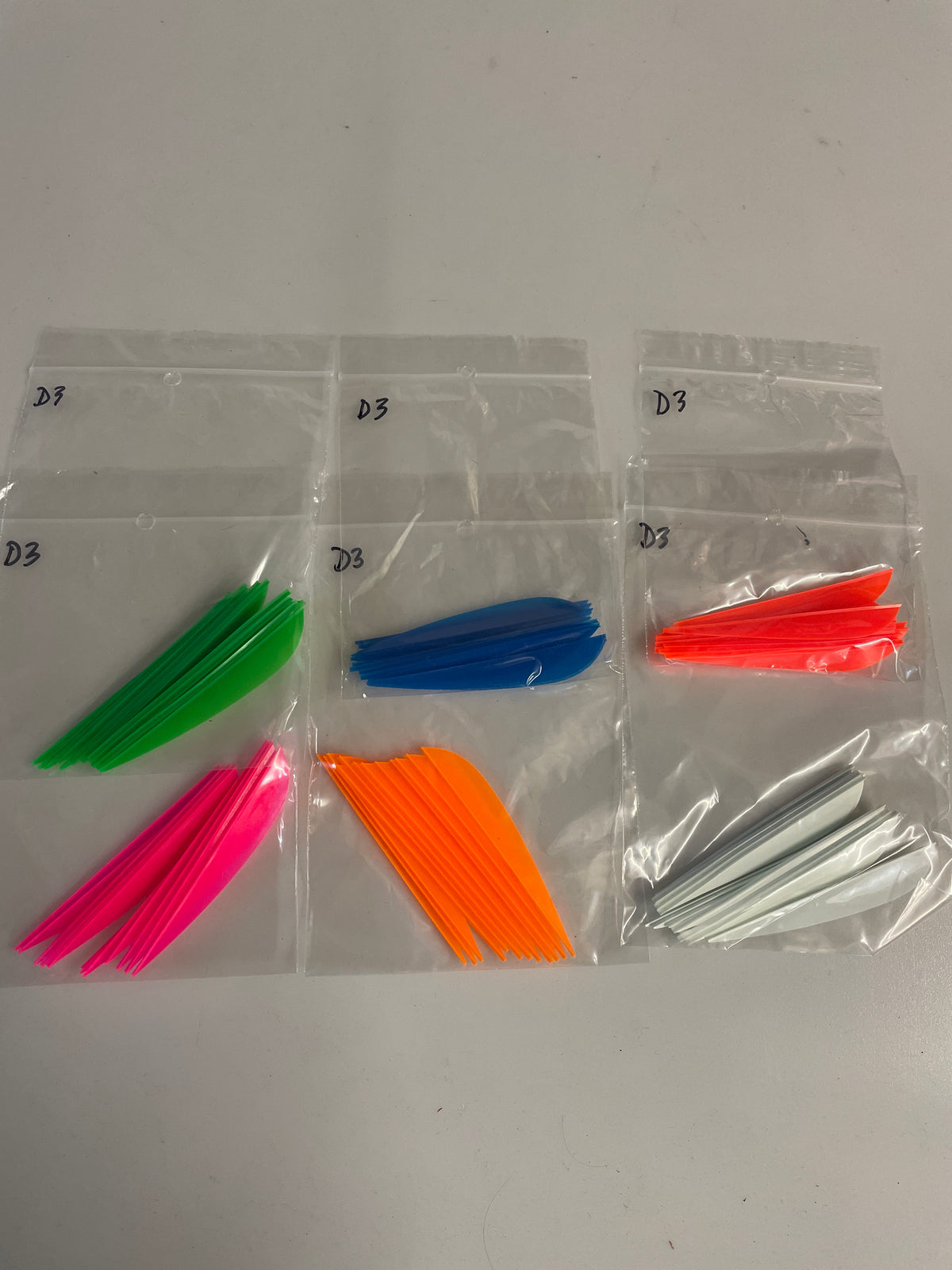 Dozen packs of Flex fletch D3 fletchings.