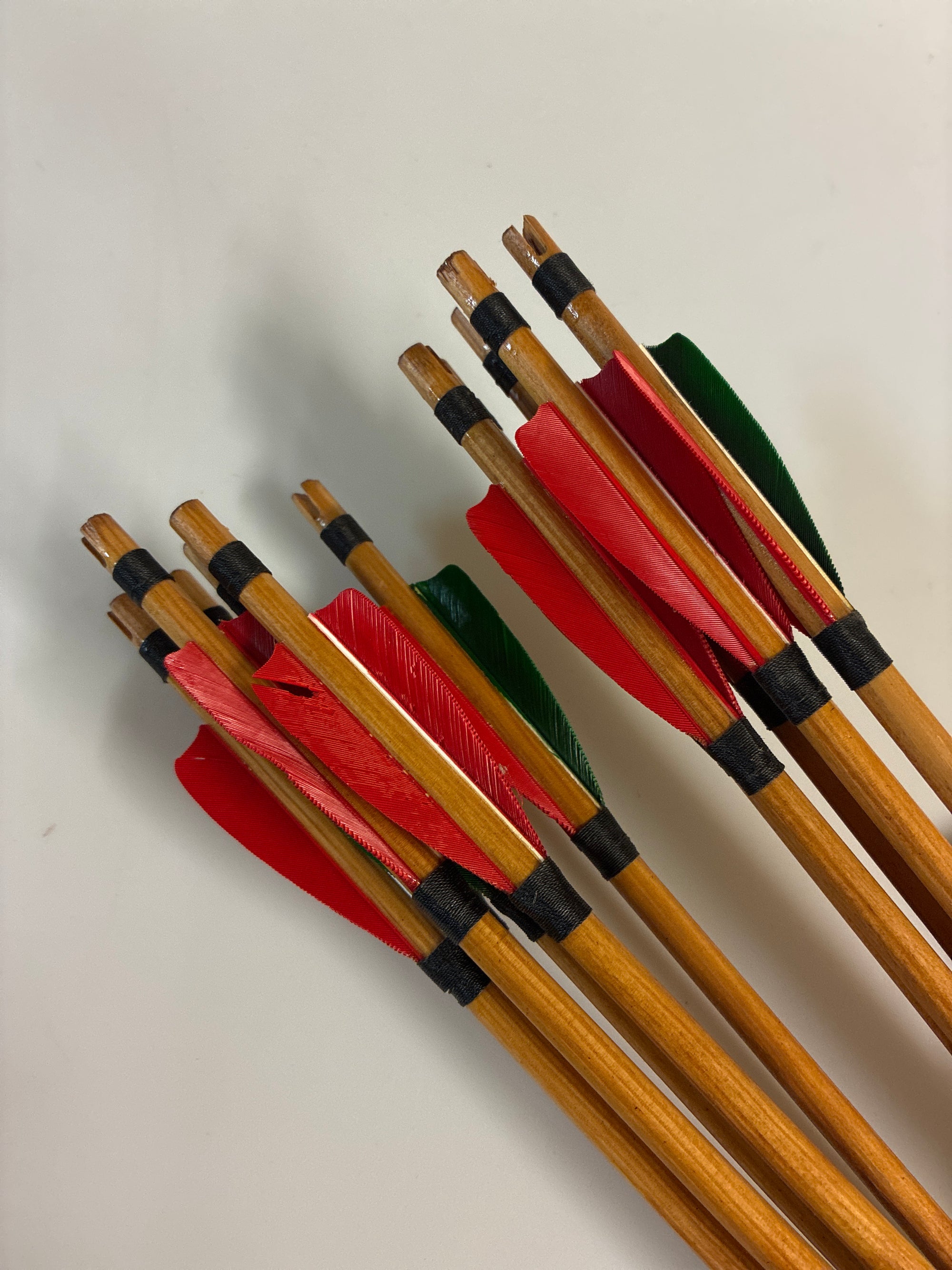 11xhandmade primitive arrows. 45lb @ 26”. Self nocked, 100gn piles.