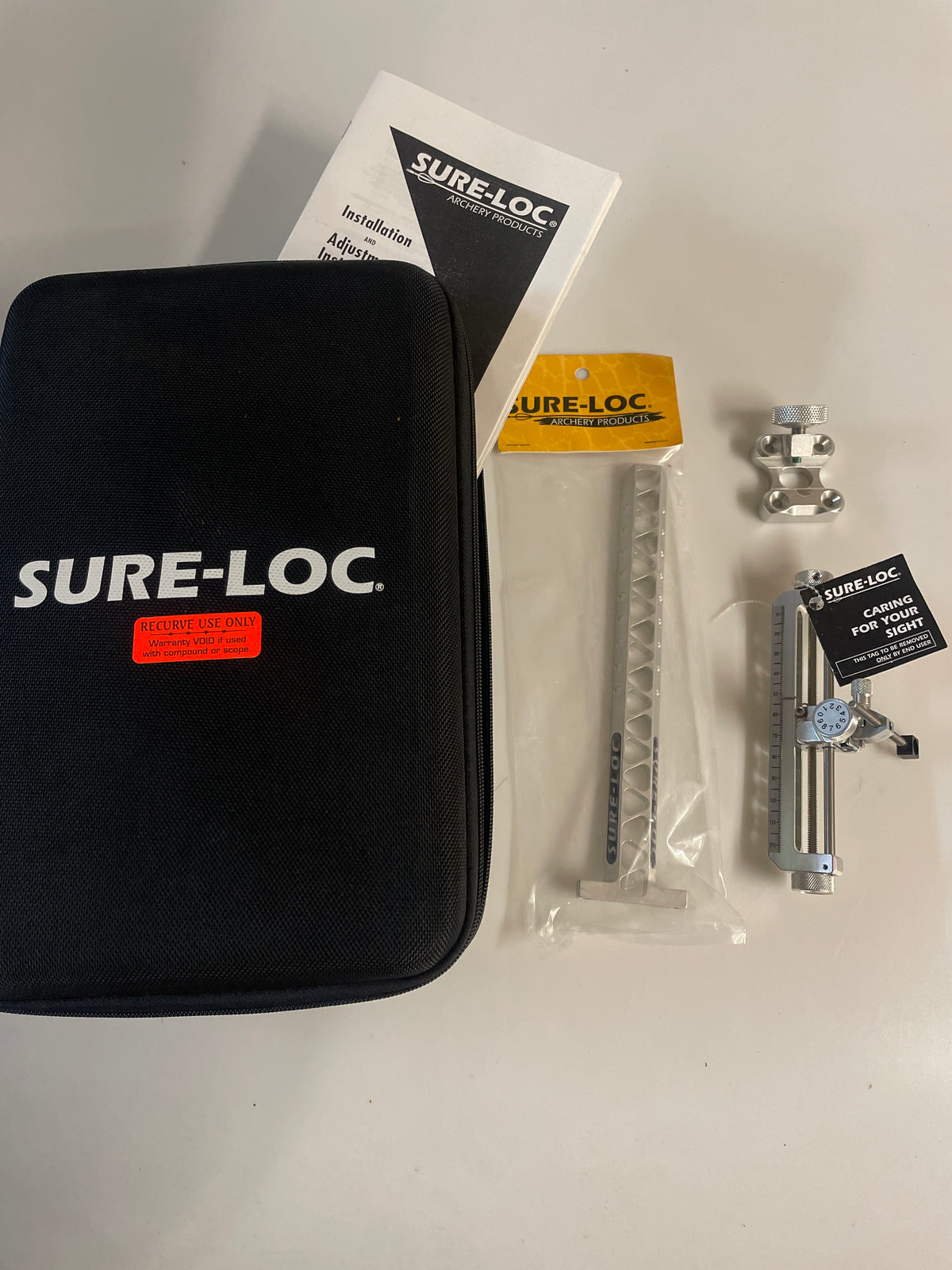 Discontinued Sureloc Quest-X recurve sight. R/h silver. 9” extension, 550 drop.